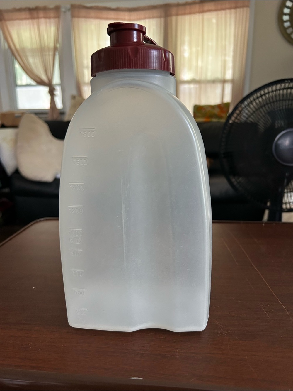 Rubbermaid 2 quart container with small pour spout and the screw on lid.